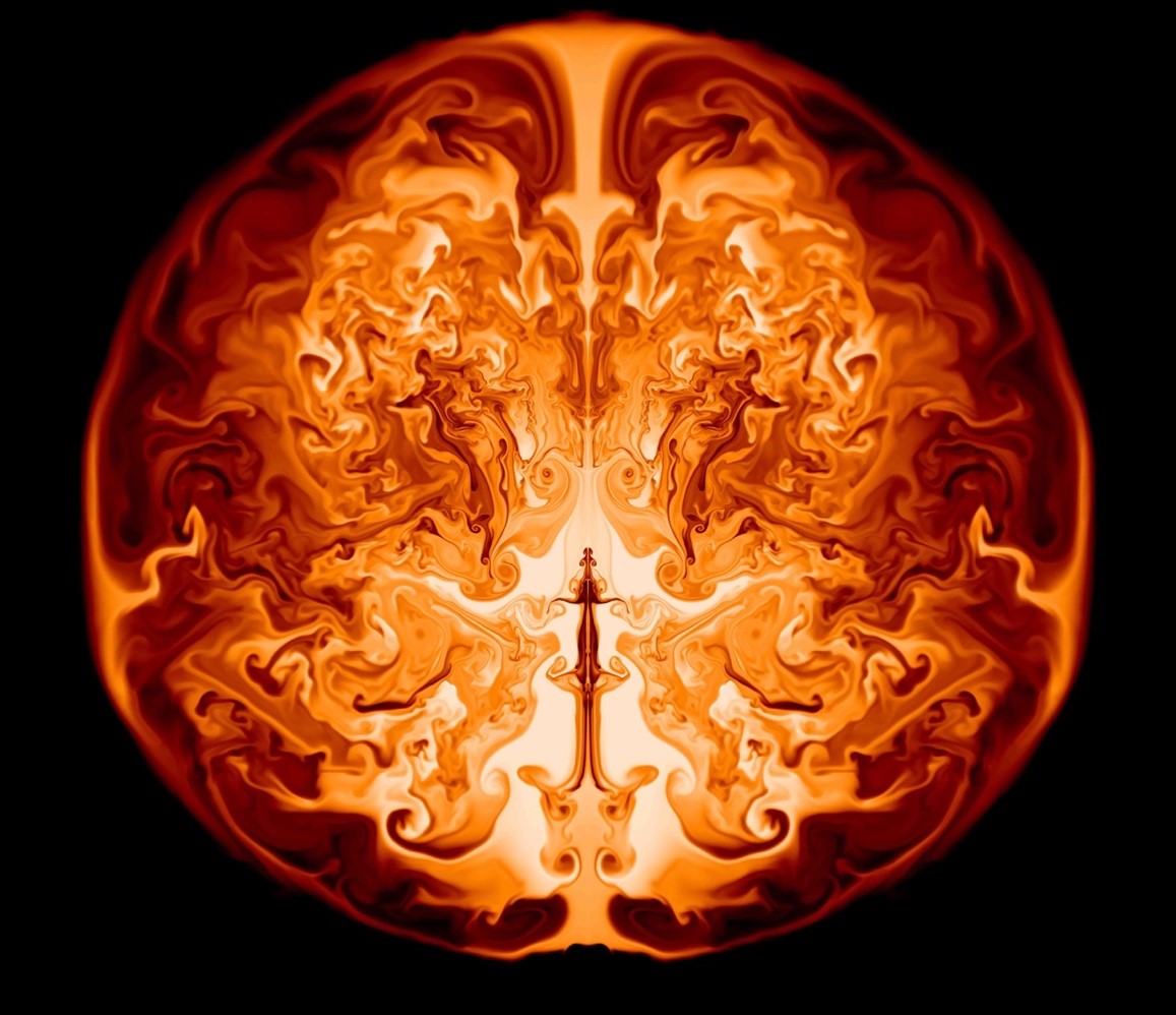 Fig 2: An exploding supermassive star. This two-dimensional image presents a mirrored half-slice through the interior of an exploding supermassive star of 55,500 solar masses. The size of the star is about the Earth’s orbit. In the core of the supermassive stars, nuclear burning is forging helium into oxygen and driving violent fluid instabilities that further accelerate the burning. Within a few more hours, the explosion will have released enough energy to blow up the star completely. (From: K.-J. Chen  Physics Today 68, 1, 68 (2015) & K.-J. Chen et al., Astrophys. J. 790, 162, 2014)